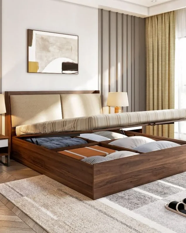 Wooden storage bed lifted open on hydraulic struts, showing the bedding stored below.