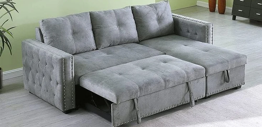 The same sofa with the seat pulled forward, opened out flat into a bed.
