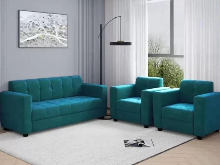 Teal sofa set with matching armchairs and a side table.